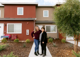 Claudia Miranda and her mother, Martha Baltazar, in front of Martha’s home at Rosaleda Village in Wasco, Calif.