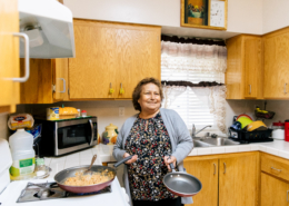 Maria Chavira cooks tortillas, eggs, and beans inside her home