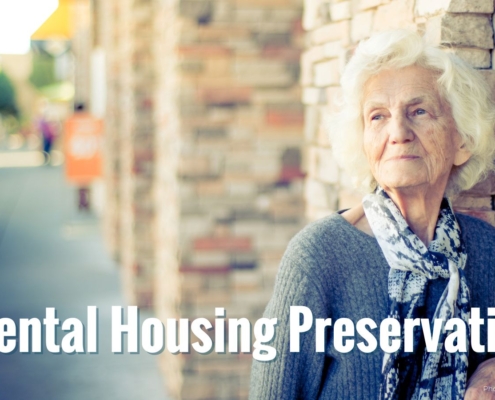 An elderly woman on a main street road