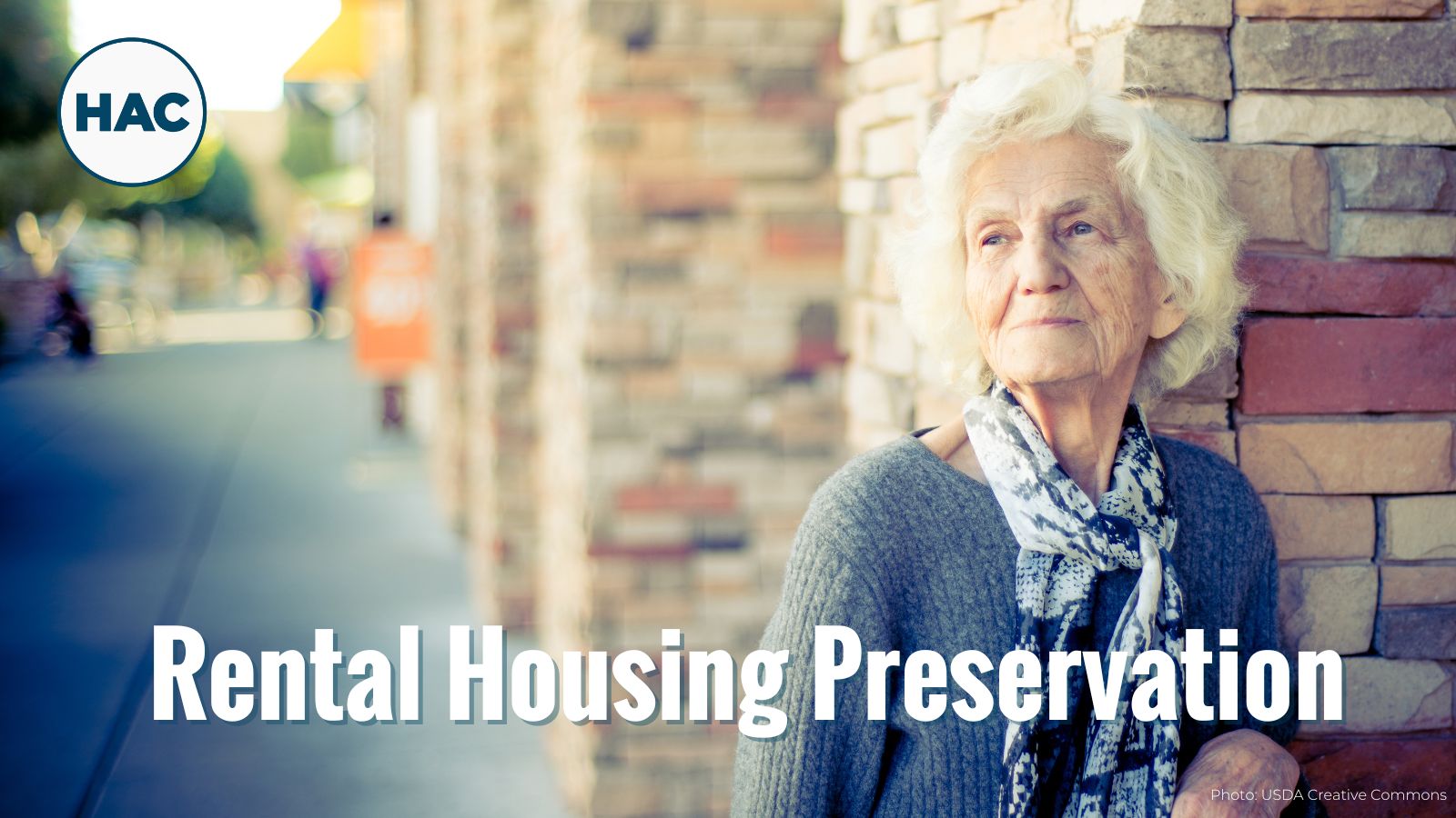 An elderly woman on a main street road